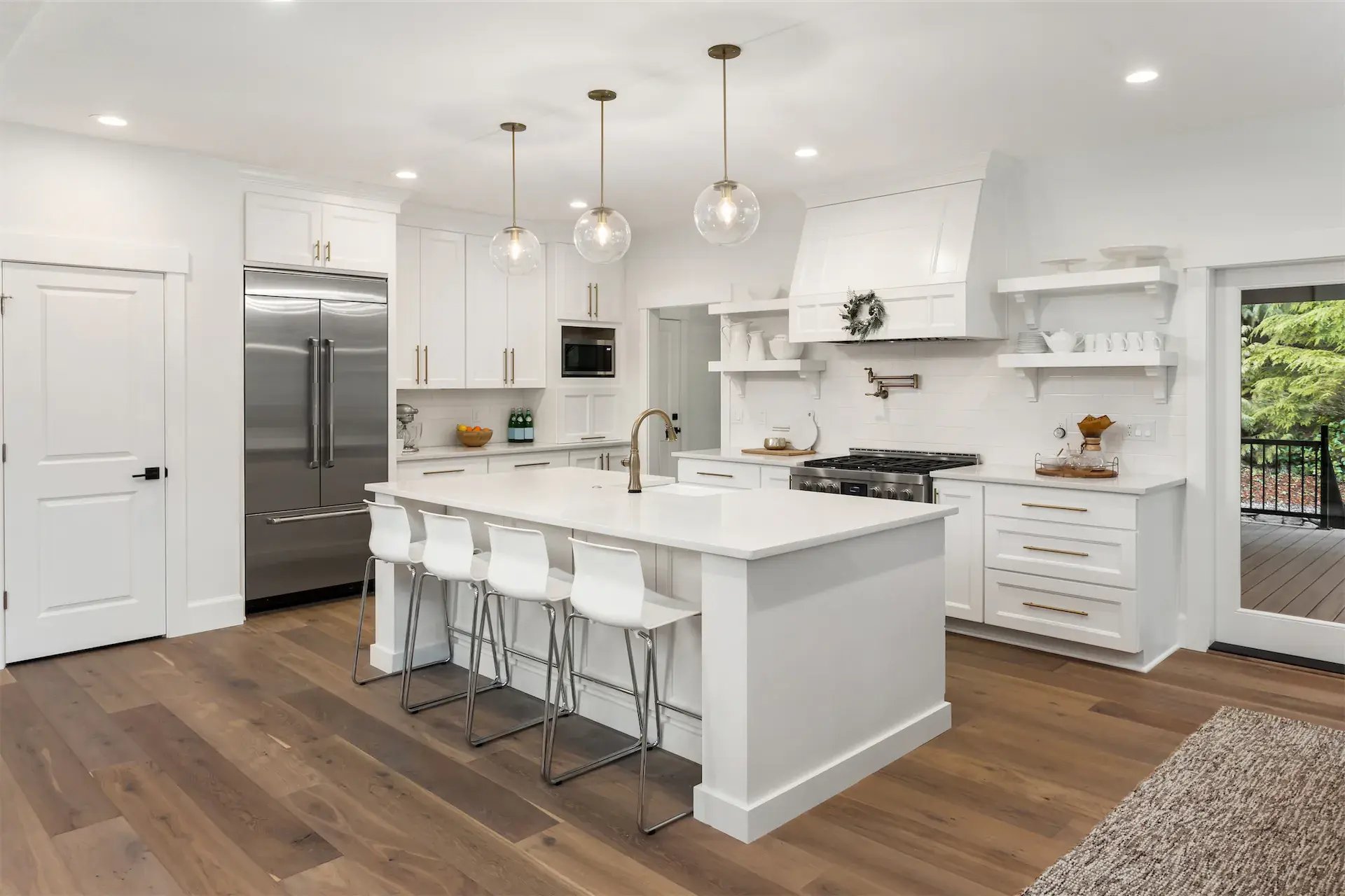 Remodeled kitchen featuring white cabinetry and dark wood flooring by Executive Remodeling in Minneapolis, MN Remodeled kitchen featuring white cabinetry and dark wood flooring by Executive Remodeling in Minneapolis, MN